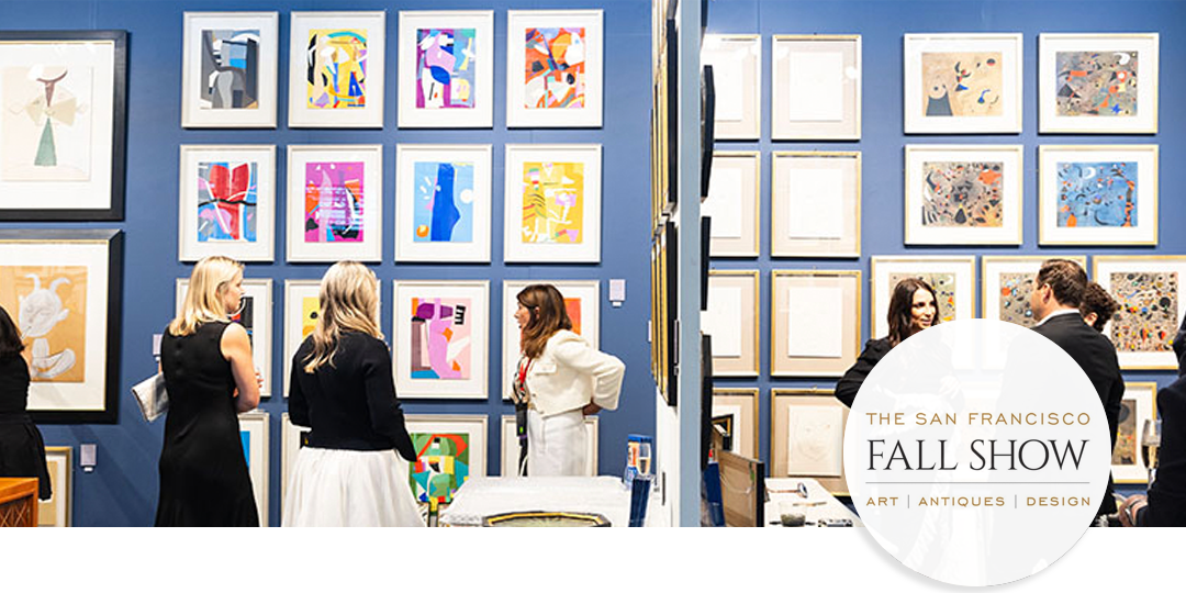Visitors browsing a gallery wall of colorful modern art during the San Francisco Fall Show at Fort Mason, highlighting the fair’s mix of design and culture.
