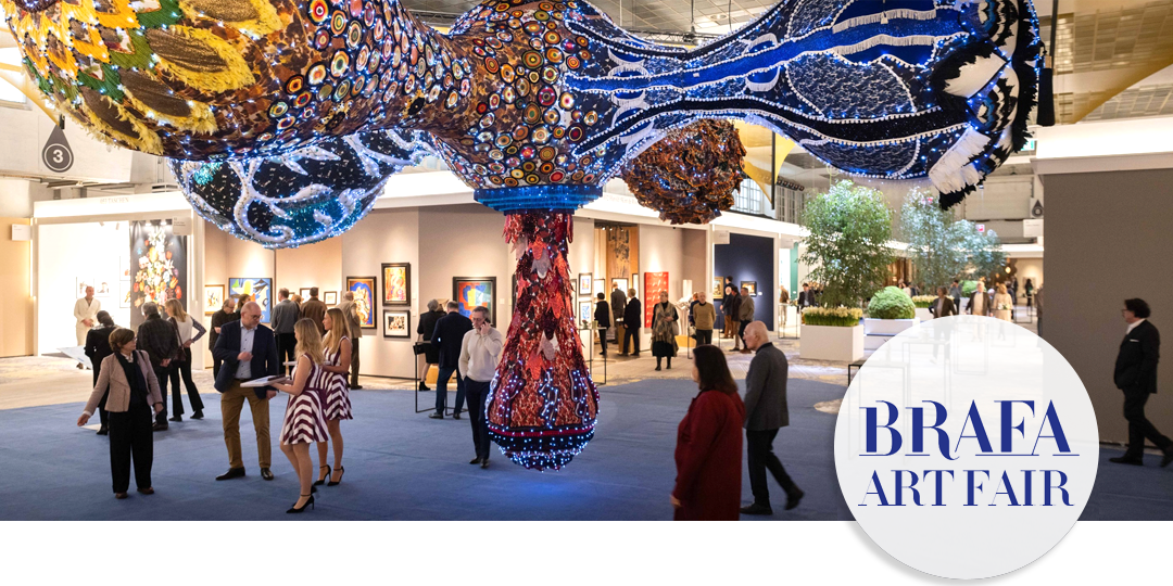 Dramatic contemporary art installation at BRAFA Art Fair with visitors viewing galleries and walking through the fair.