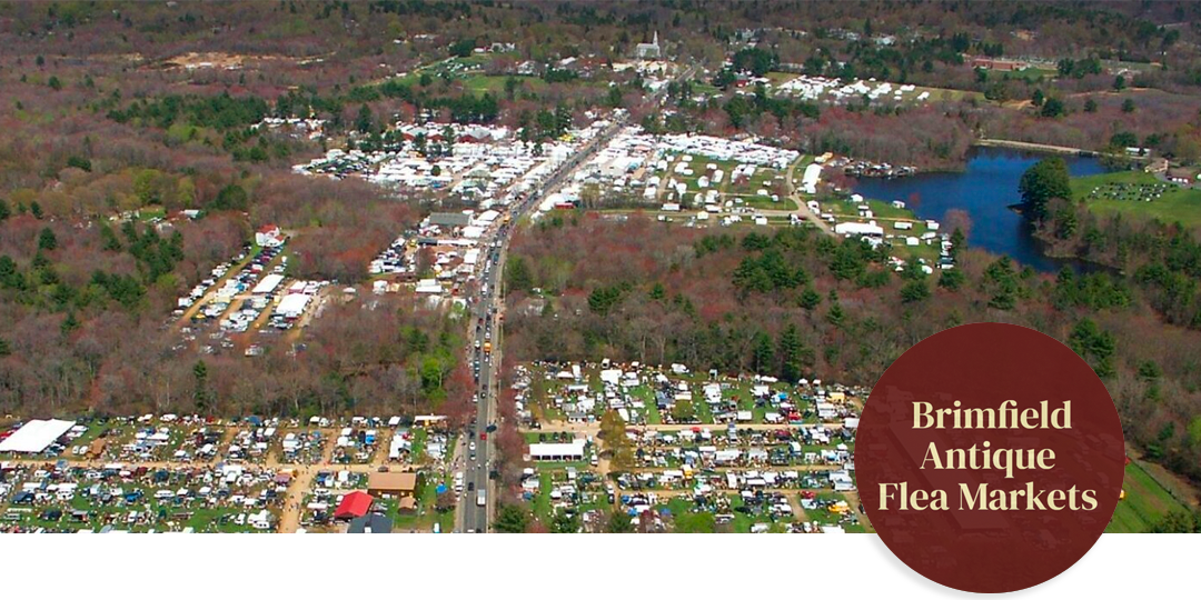 Expansive aerial view of Brimfield Antique Flea Market’s tents stretching across New England fields, emphasizing the scale of this legendary outdoor fair.