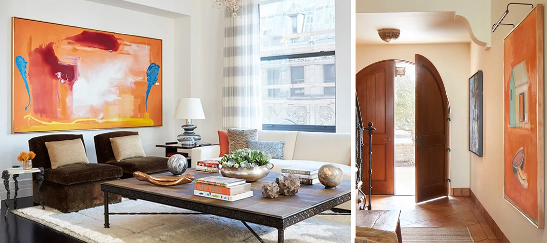 Interiors by Suzanne Tucker showcasing how bold contemporary art and antiques coexist — vibrant orange paintings paired with textured furnishings, natural wood, and architectural warmth.